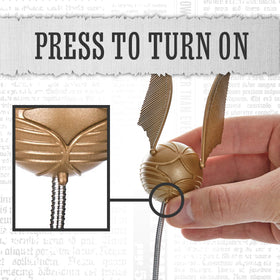 Paladone Lumi Clip hovering over page provides precise illumination.