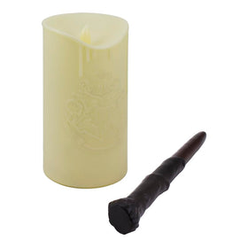 Paladone Hogwarts Crest candle on shelf as magical decor piece.
