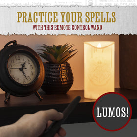Paladone Hogwarts Crest LED candle on desk creates study-night mood.