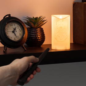 Paladone Hogwarts Crest Candle with wand remote for effortless lighting.