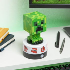 Paladone Minecraft Creeper night light emits a soft green glow for bedtime.