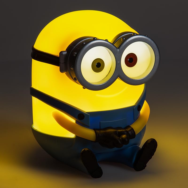 Paladone Minions Bob Light on a bedside table providing cozy glow.