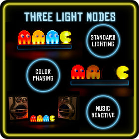 Paladone Pac-Man light on desk, ideal centerpiece for gaming den.