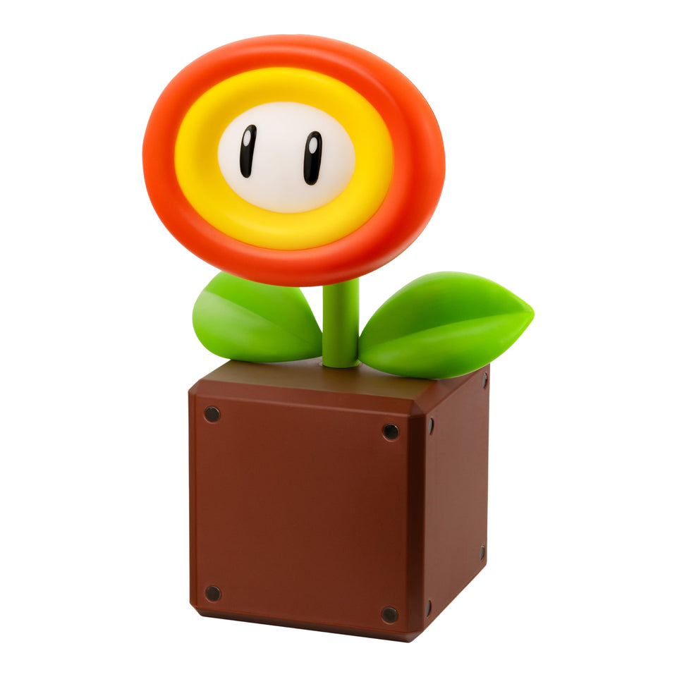 Paladone Super Mario Fireflower Lamp on desk emitting warm ambient light for late night gaming