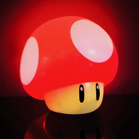 Paladone mushroom light on desk creates nostalgic gaming vibe.