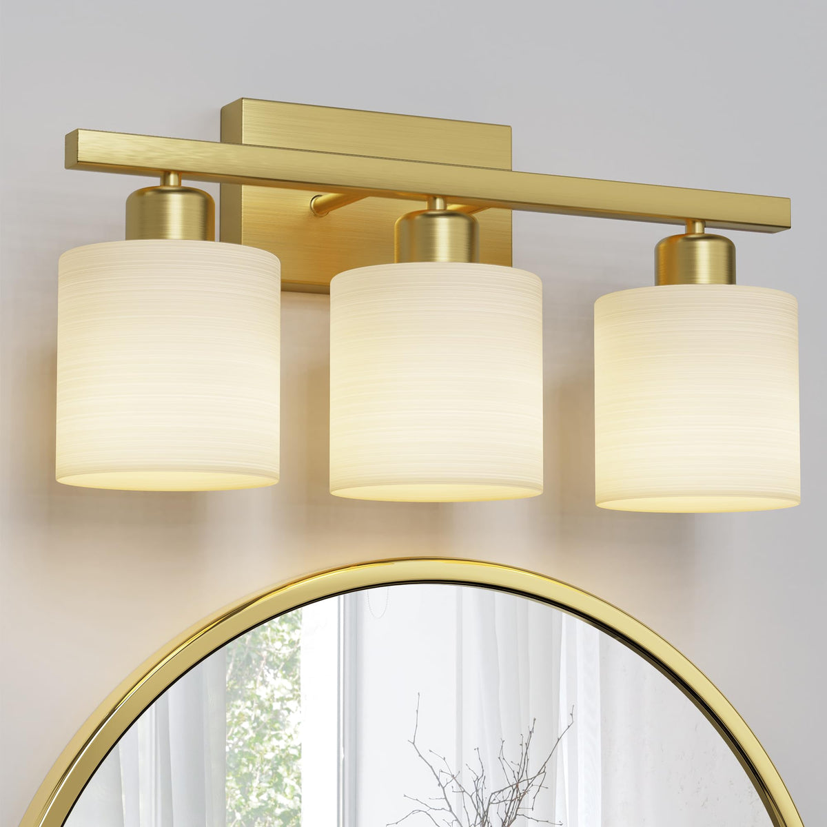 PARTPHONER 3-light brushed-gold bathroom fixture brightens the vanity area