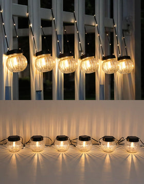 PARTPHONER solar lights hanging globes illuminate outdoors with bright, energy-saving glow.