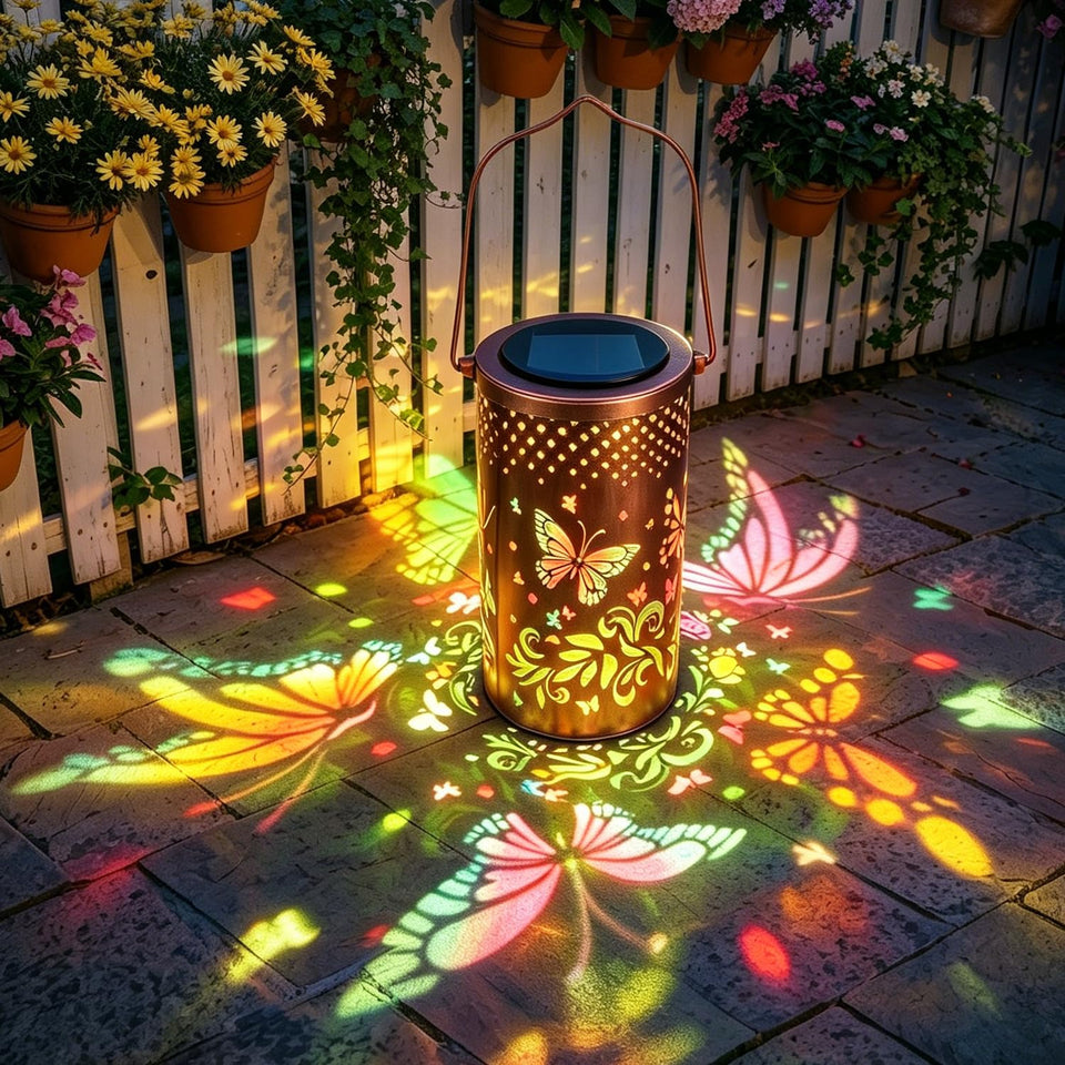 PASUTO butterfly solar lantern lights up at dusk for vibrant garden ambiance.