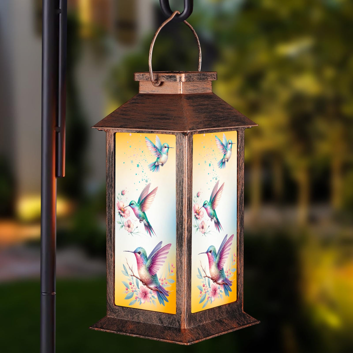 Pawatee solar lantern hummingbird pattern casts warm garden glow