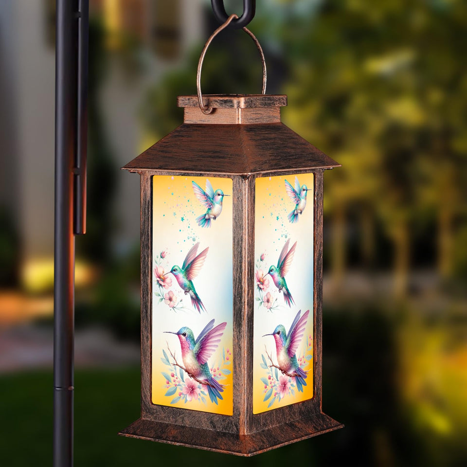 Pawatee solar lantern hummingbird pattern casts warm garden glow