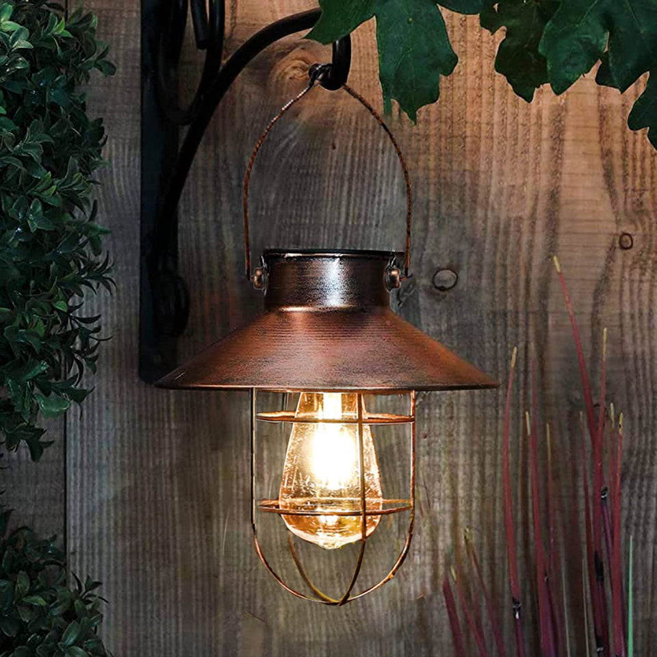 Pearlstar solar lantern front view in brushed copper adds rustic charm to outdoor spaces