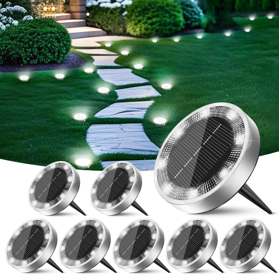 Peasur solar disc light guides the garden pathway with bright nighttime illumination.