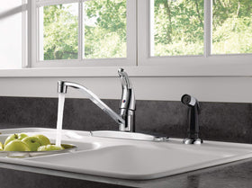 Peerless chrome side sprayer with retractable hose for quick mess cleanup.