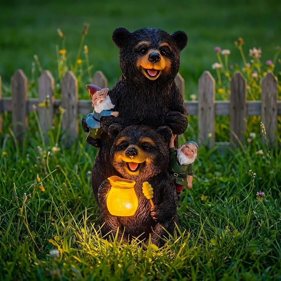 PETAFLOP bear statue with glowing honey jar lights up outdoor evenings.