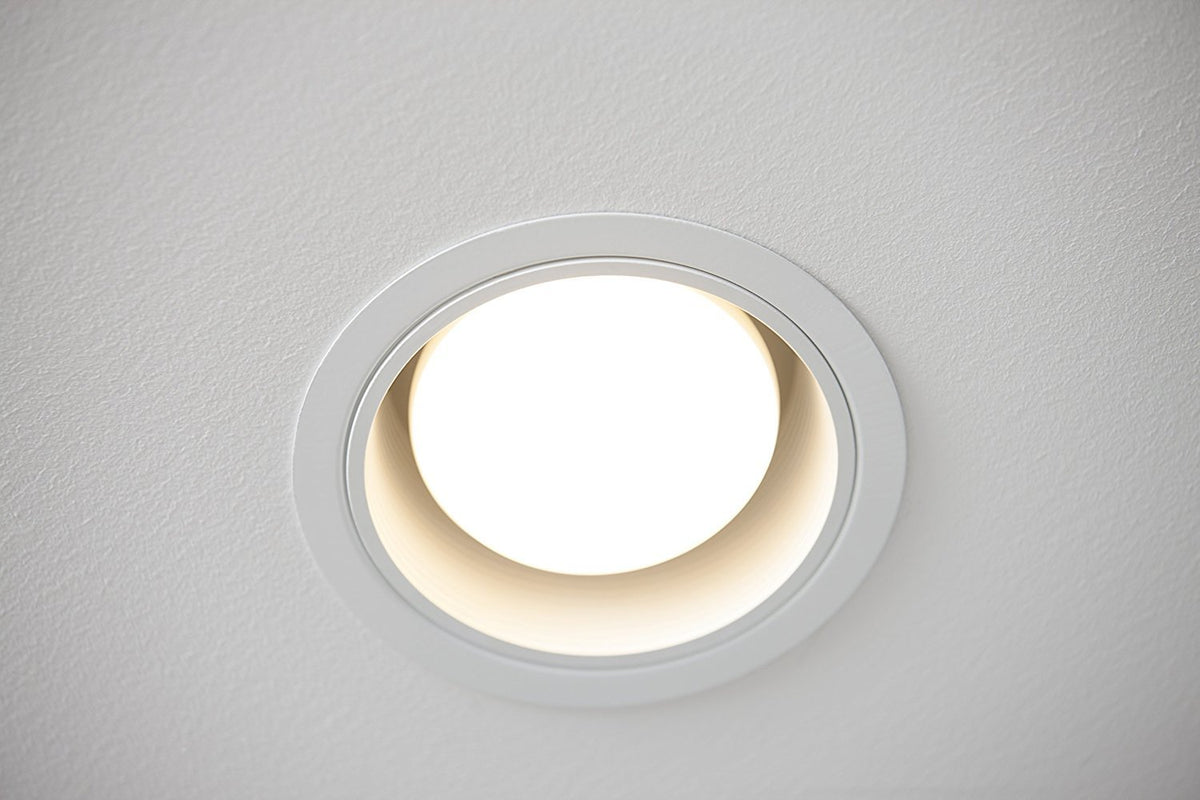 Close-up of Philips BR30 LED bulb with E26 base in focus.