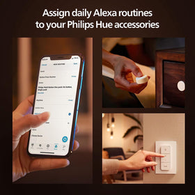 Philips Hue dimmer switch in hand enables effortless dimming and control.