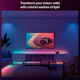 Hue Essential strip TV backlight enhances viewing with subtle color glow.