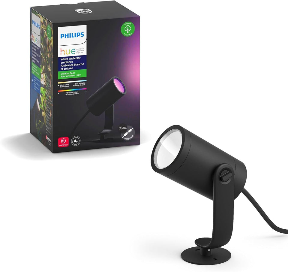 Philips Hue Lily outdoor spotlight assembly lighting a garden path for safe navigation