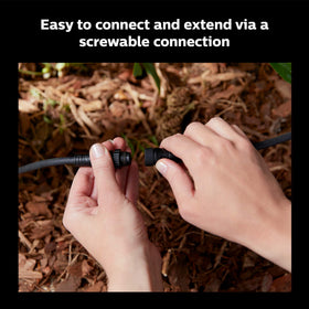 Philips Hue T-connector linking multiple outdoor lights in a single run.