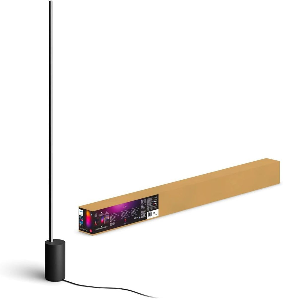 Philips Hue Signe gradient floor lamp in black delivering ambient lighting.
