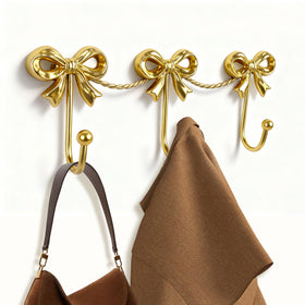 Pipigaty gold bow hooks wall for organized entryway coats and bags.
