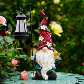 Pohabery gnomes outdoor statue with solar light lighting the porch at dusk