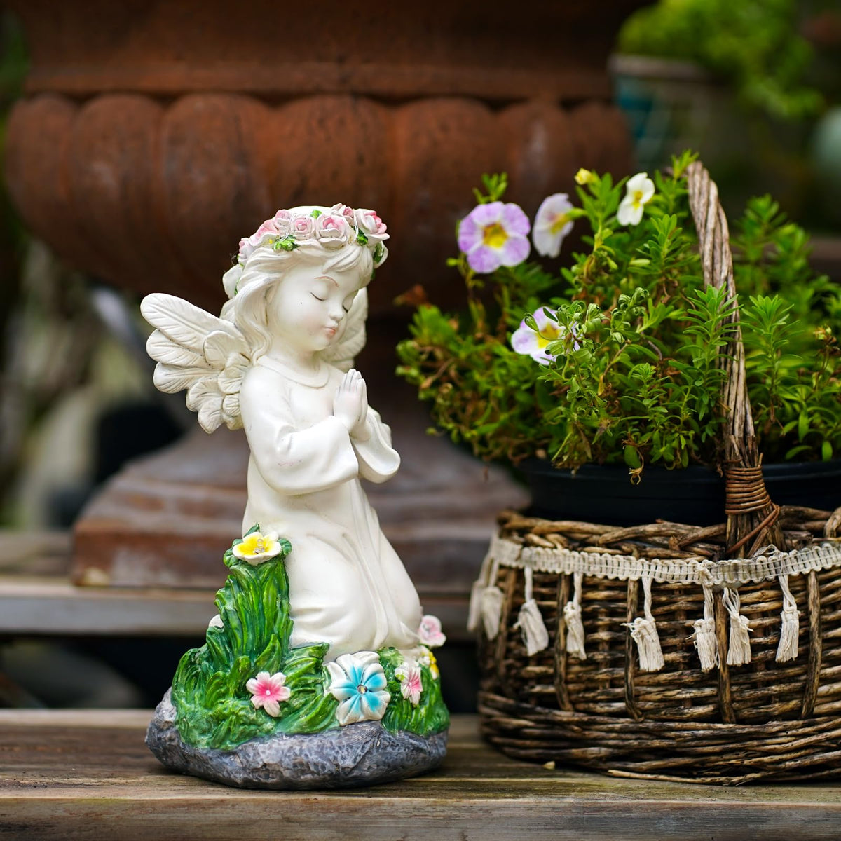 Pohabery Solar Angel Figure lights at dusk to softly brighten outdoor spaces.
