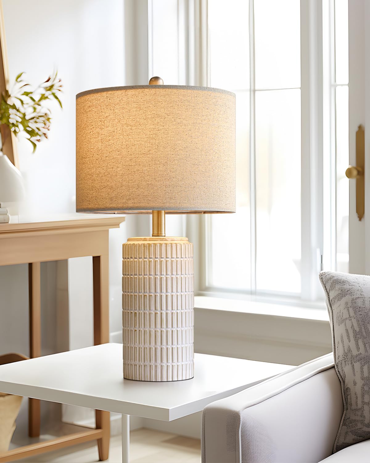PoKat bedside lamp on a nightstand enhances decor.