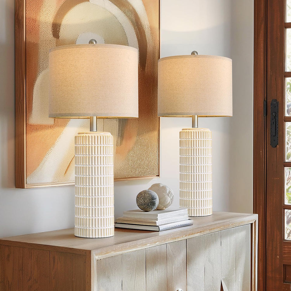 PoKat 27.5-inch tall table lamp set on a white nightstand with gold accents.