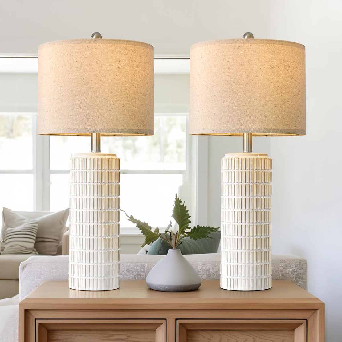 Close-up of PoKat ceramic base and linen shade showing modern design.