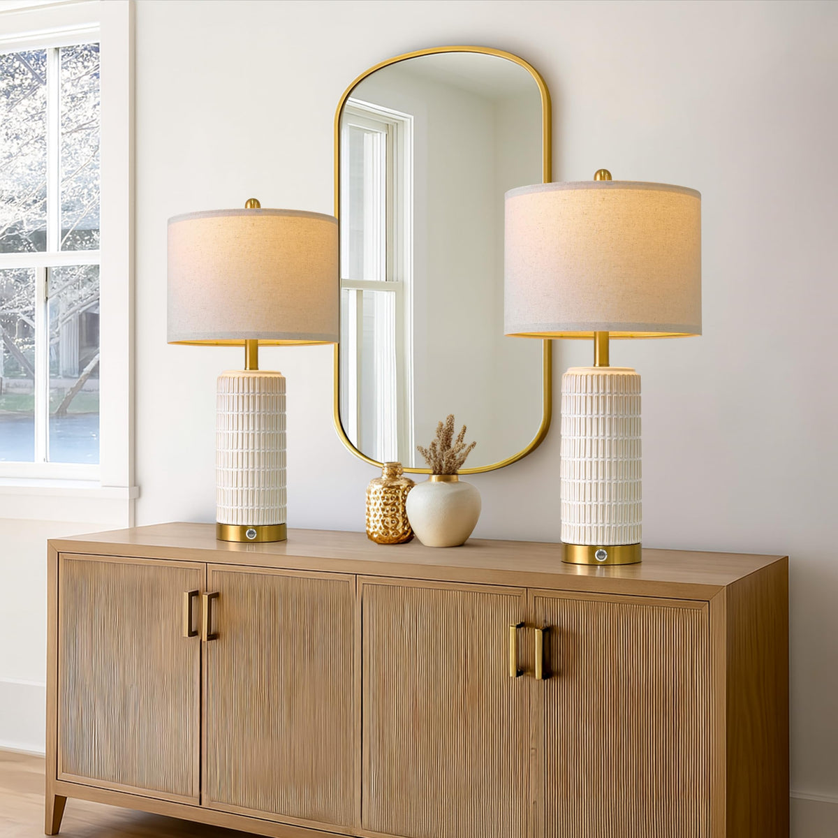Pokat modern ceramic lamp in white with gold base.