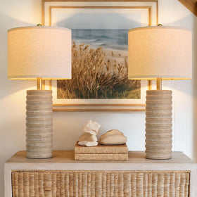 PoKat pair of lamps on a side table add warm ambiance.