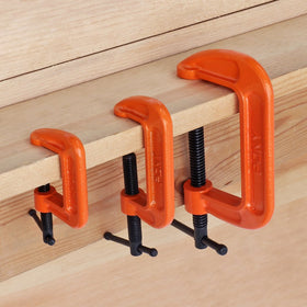 PONY C clamp in use for metalwork and crafting projects.