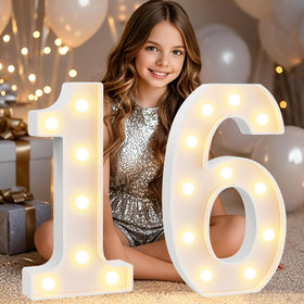 Pooqla 16th birthday numbers glow as a striking photo-ready centerpiece