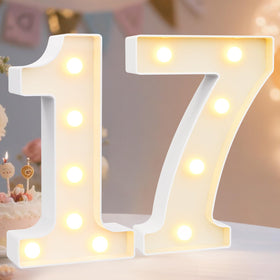 Pooqla light up number 1 on table with warm glow for party centerpiece.