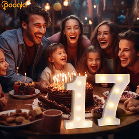 Pooqla light up number 7 on table with warm glow for party centerpiece.