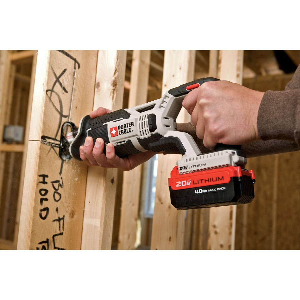 PORTER-CABLE reciprocating saw in use cutting drywall and wood.