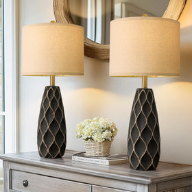 PORTRES ceramic table lamp on desk creates focused workspace ambiance