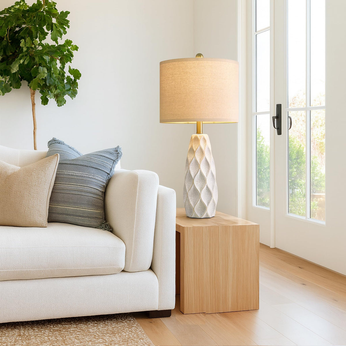 Portres nightstand lamp casting warm ambient light.