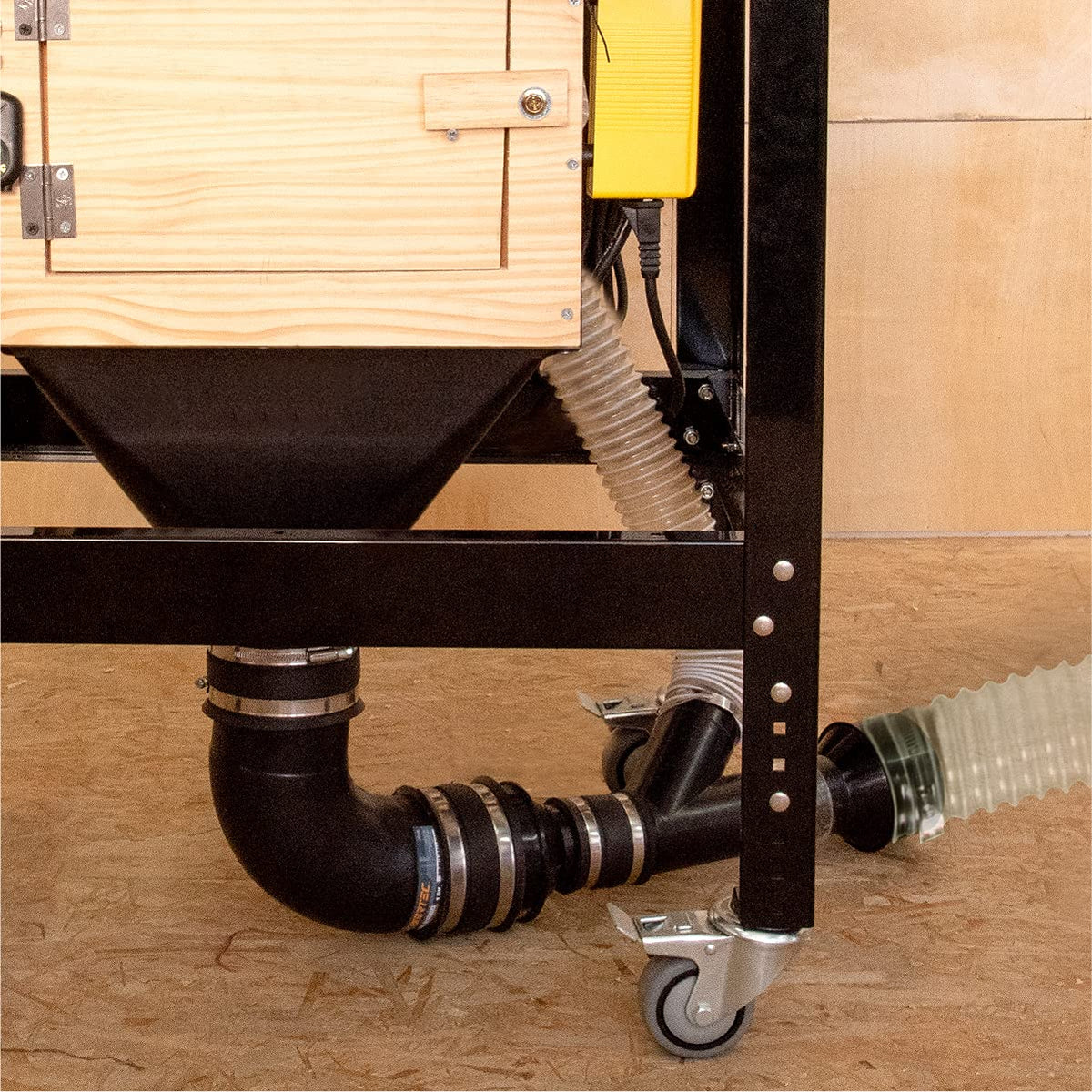 POWERTEC unit catches sawdust and debris from woodworking tools.