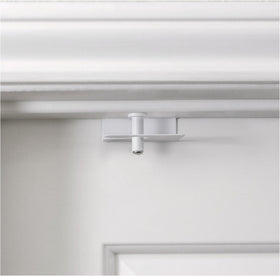 Predictable Solutions GlideLok top lock on a door keeps kids safely on one side.