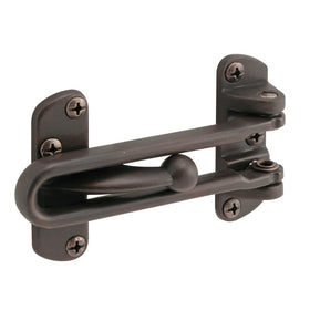 Prime-Line U10309 swing bar lock mounted on hinged door for added safety.