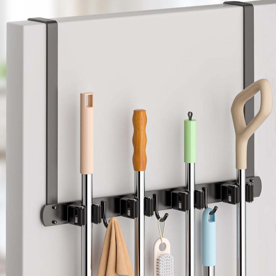 PrimZooty over-the-door broom holder neatly organizes tools behind the door.