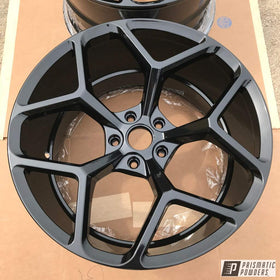 PRISMATIC POWDERS gloss black finish on metal for showroom-ready protection.