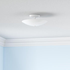 Progress Lighting white glass shade producing a soft glow for cozy bathrooms.