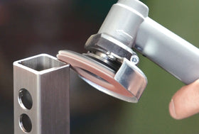 Proxxon 100-grit flap disc attached for deburring and smoothing.