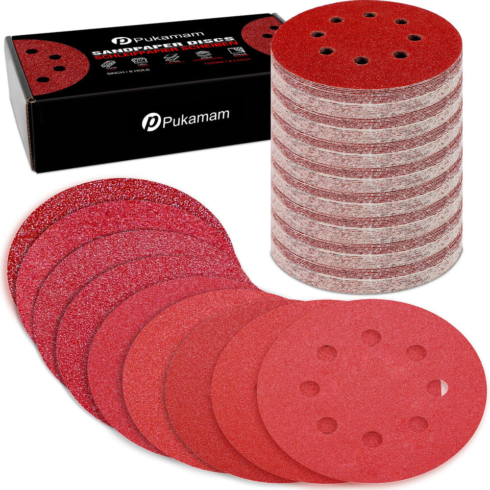 Pukamam 170pcs sanding discs set displayed on a workbench for versatile projects.