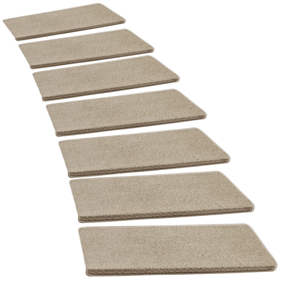 PURE ERA bullnose stair treads on cream-gray stairs offer secure footing.