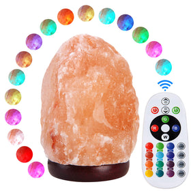 Pursalt pink crystal salt lamp on wooden base emits warm ambient light.