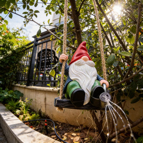 QCF IP65 weatherproof gnome statue ready for rain, snow, and sun.